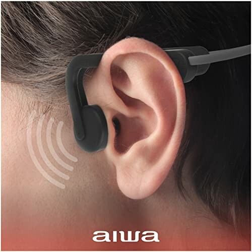 Aiwa ear hook headphones on person's ear