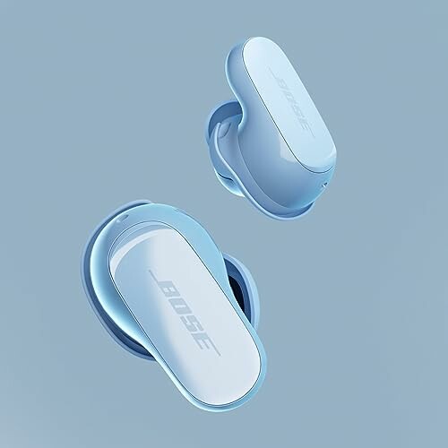 Blue Bose wireless earbuds on a light blue background