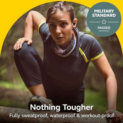 Woman in workout gear exercising outdoors with military standard badge.