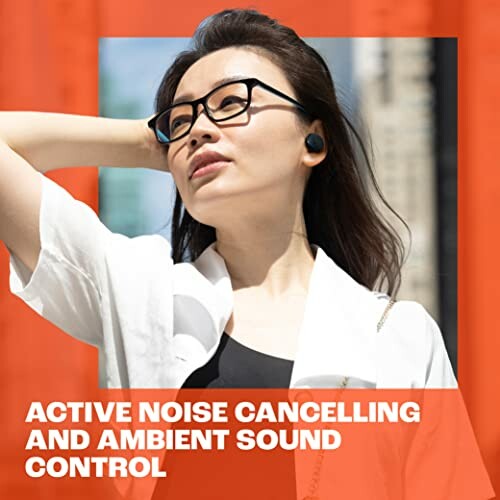 Woman wearing earbuds with active noise cancelling outdoors.